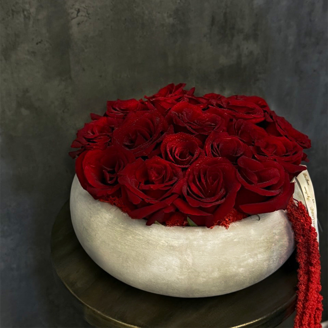 Elegant round red rose bouquet in matte white ceramic bowl – romantic floral centerpiece for Mother's Day, anniversary, or luxury home decor