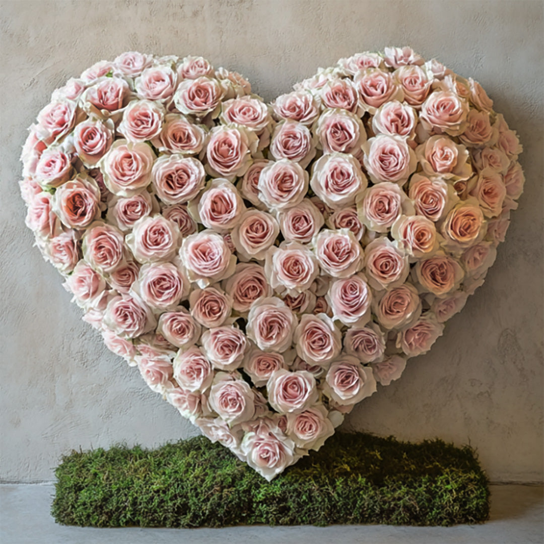 Heart-shaped arrangement crafted with soft blush pink roses on a natural moss base. A romantic and graceful floral design by Flowers Lounge by Iness, available for delivery across Los Angeles and nearby areas.