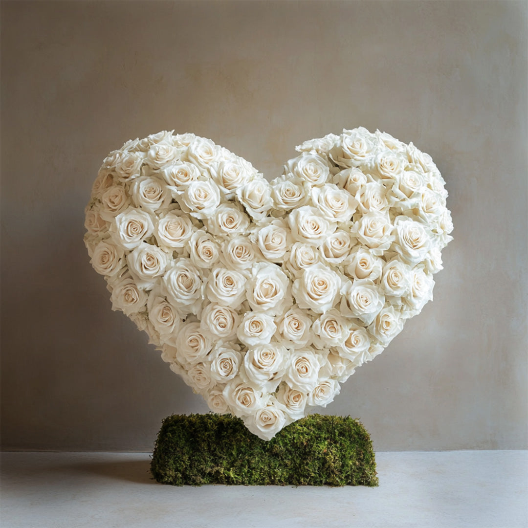 Luxurious white rose heart arrangement on a natural moss base — perfect for sympathy and memorials. Handcrafted by Flowers Lounge by Iness and delivered across Los Angeles, including Beverly Hills, Santa Monica, and Burbank.