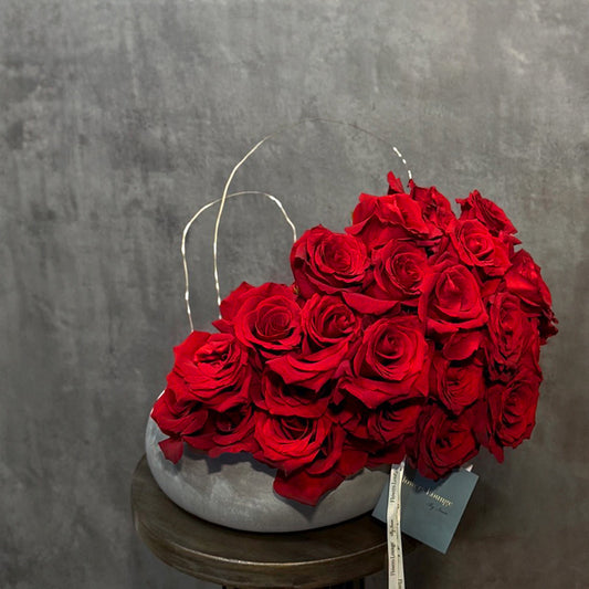 Heartfelt Embrace – Red Roses in Stone Vase